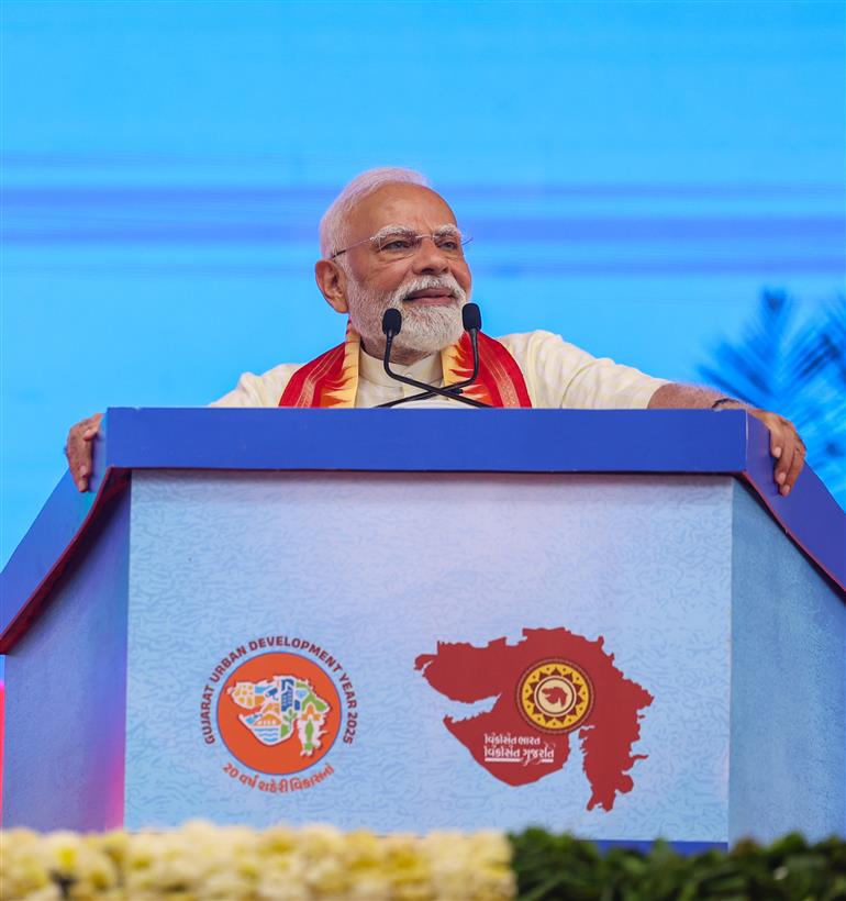 PM addressing the gathering at public function on the sidelines of the foundation stone laying, inauguration and dedication of multiple development projects to the nation held at Khodaldham ground (Ahmedabad), in Gujarat on August 25, 2025.