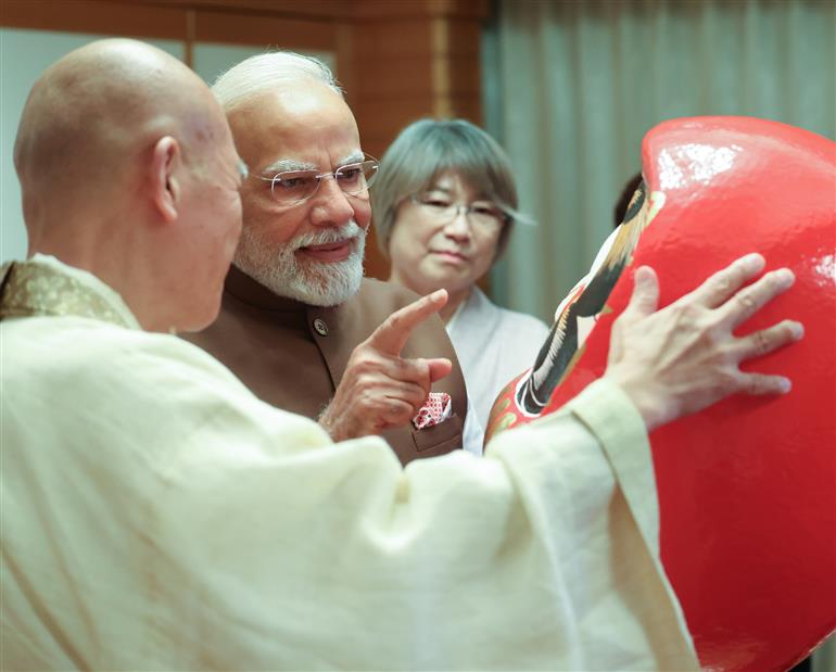 PM presented with a Daruma doll by the Chief Priest of Shorinzan Daruma Ji Temple, Mr. Rev Seishi Hirose in Tokyo, Japan on August 29, 2025.:Prime Minister's Office PM presented with a Daruma doll by the Chief Priest of Shorinzan Daruma Ji Temple, Mr. Rev Seishi Hirose in Tokyo, Japan on August 29, 2025.:Prime Minister