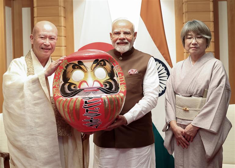 PM presented with a Daruma doll by the Chief Priest of Shorinzan Daruma Ji Temple, Mr. Rev Seishi Hirose in Tokyo, Japan on August 29, 2025.:Prime Minister's Office PM presented with a Daruma doll by the Chief Priest of Shorinzan Daruma Ji Temple, Mr. Rev Seishi Hirose in Tokyo, Japan on August 29, 2025.:Prime Minister