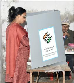 A female voter casting her vote at a polling booth during the Delhi Assembly Election at Alok Bharti Secondary School, Khureji Khas, in New Delhi on February 05, 2025.