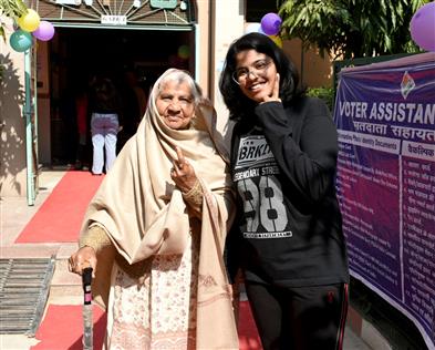 Female voters showing mark of Indelible Ink after casting their votes during the Delhi Assembly Election 2025 at Lovely Public School, Priyadarshini Vihar, in Delhi on February 05, 2025.