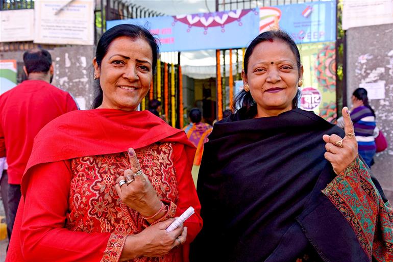 Female voters showing mark of indelible ink after casting their votes at a polling booth during the Delhi Assembly Election 2025 at Atal Adarsh Vidyalaya, Lodhi Road, in New Delhi on February 05, 2025.