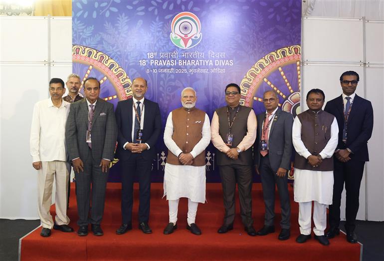 PM in a group photograph during the inauguration of the 18th Pravasi Bharatiya Divas (PBD) convention at Bhubaneswar, in Odisha on January 09, 2025.