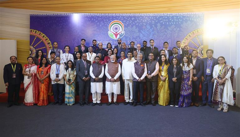 PM in a group photograph during the inauguration of the 18th Pravasi Bharatiya Divas (PBD) convention at Bhubaneswar, in Odisha on January 09, 2025.