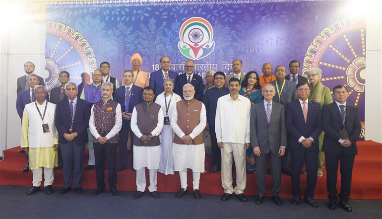 PM in a group photograph during the inauguration of the 18th Pravasi Bharatiya Divas (PBD) convention at Bhubaneswar, in Odisha on January 09, 2025.