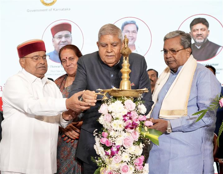 The Vice President of India, Shri Jagdeep Dhankhar lighting the lamp during the inauguration of 25th National Conference of Chairpersons of State Public Service Commission at Bengaluru, in Karnataka on January 11, 2025.