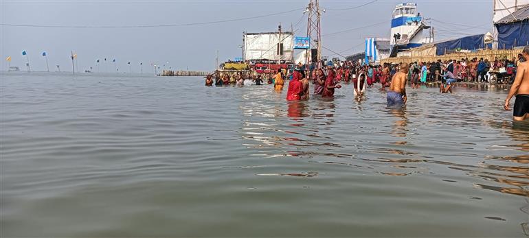 Pilgrims taking holy dip at the confluence of Bay of Bengal and Bhagarathi at Gangasagar Mela 2025, in West Bengal on January 13, 2025.:Ministry of Culture