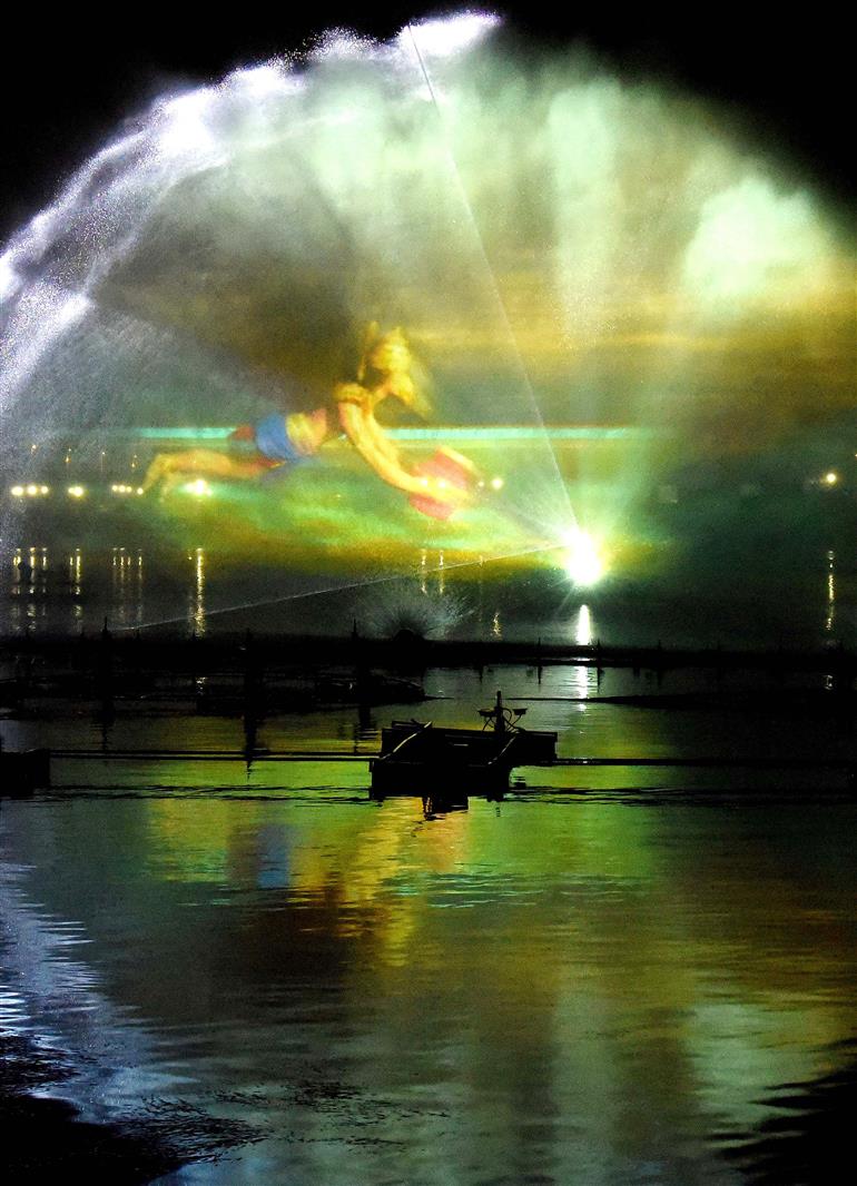 A spectacular laser show illuminates the night at the Maha Kumbh Mela 2025 in Prayagraj, creating a dazzling display of vibrant colors and imagery against the tranquil setting of the sacred waters, captured, in Uttar Pradesh on January 16, 2025.:Ministry of Culture