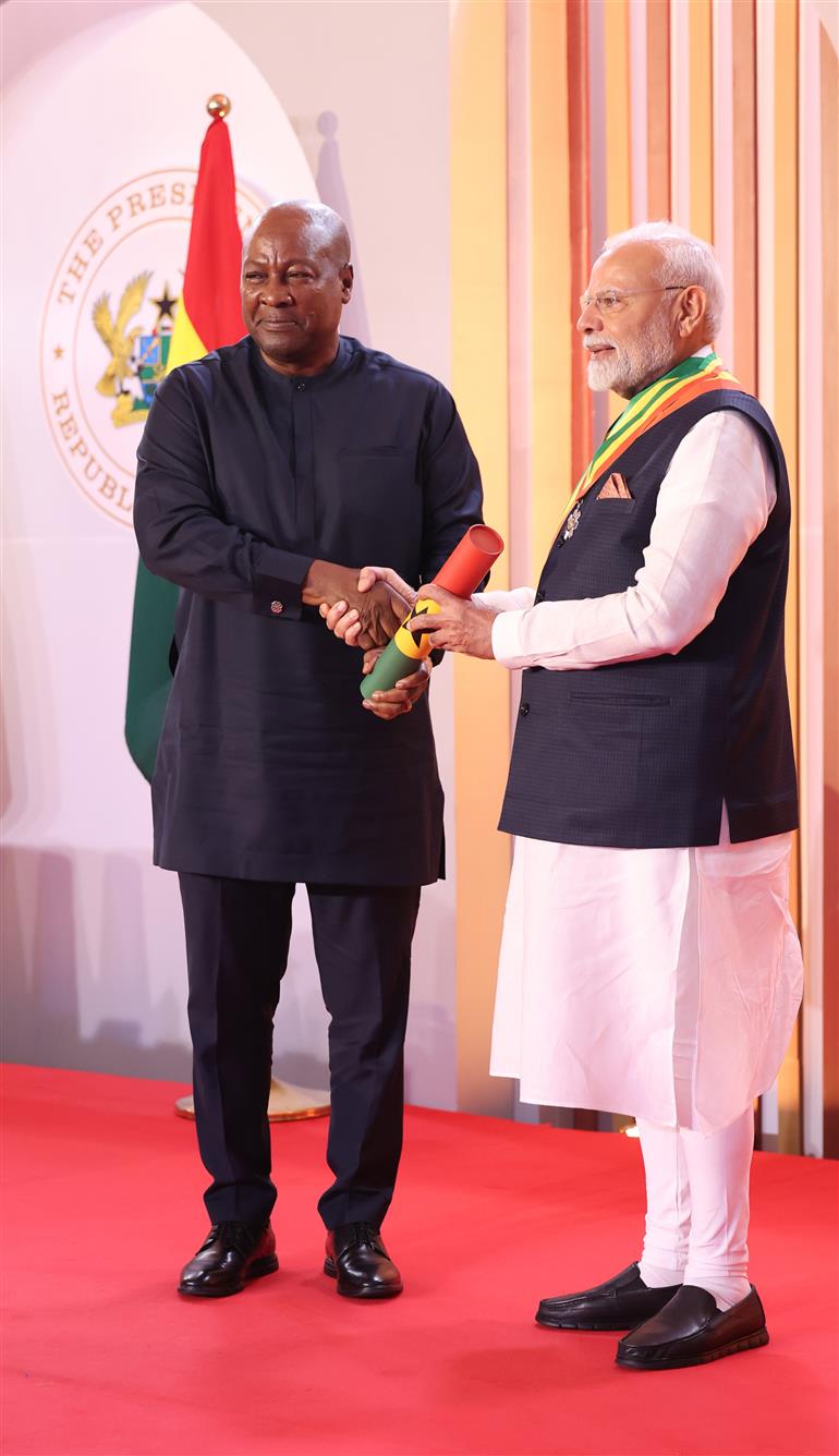 PM receiving the prestigious national award of Ghana ‘The Officer of the Order of the Star of Ghana’ by the President of the Republic of Ghana, Mr. John Dramani Mahama at Accra, in Ghana on July 02, 2025.
