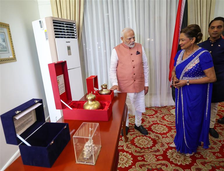 PM exchanges gifts with the Prime Minister of the Republic of Trinidad and Tobago, Ms. Kamla Persad-Bissessar at Port of Spain, in Republic of Trinidad and Tobago on July 03, 2025.:Prime Minister's Office PM exchanges gifts with the Prime Minister of the Republic of Trinidad and Tobago, Ms. Kamla Persad-Bissessar at Port of Spain, in Republic of Trinidad and Tobago on July 03, 2025.:Prime Minister