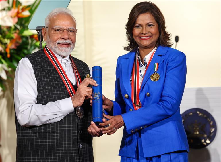 PM receiving the highest national award ‘The Order of the Republic of Trinidad & Tobago’ by the President of the Republic of Trinidad & Tobago, Ms. Christine Carla Kangaloo at Port of Spain, in Republic of Trinidad and Tobago on July 04, 2025.:Prime Minister's Office PM receiving the highest national award ‘The Order of the Republic of Trinidad & Tobago’ by the President of the Republic of Trinidad & Tobago, Ms. Christine Carla Kangaloo at Port of Spain, in Republic of Trinidad and Tobago on July 04, 2025.:Prime Minister