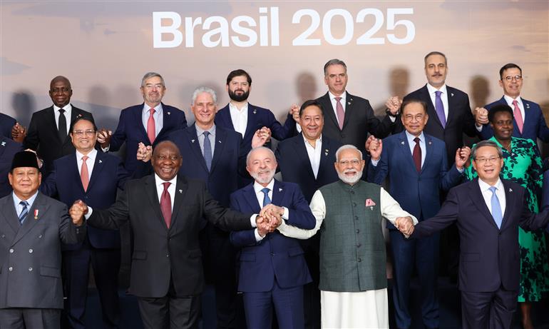 PM in a family photograph with Members, Partners and Outreach invitees on the sidelines of 17th BRICS Summit at Rio de Janeiro, in Brazil on July 07, 2025.