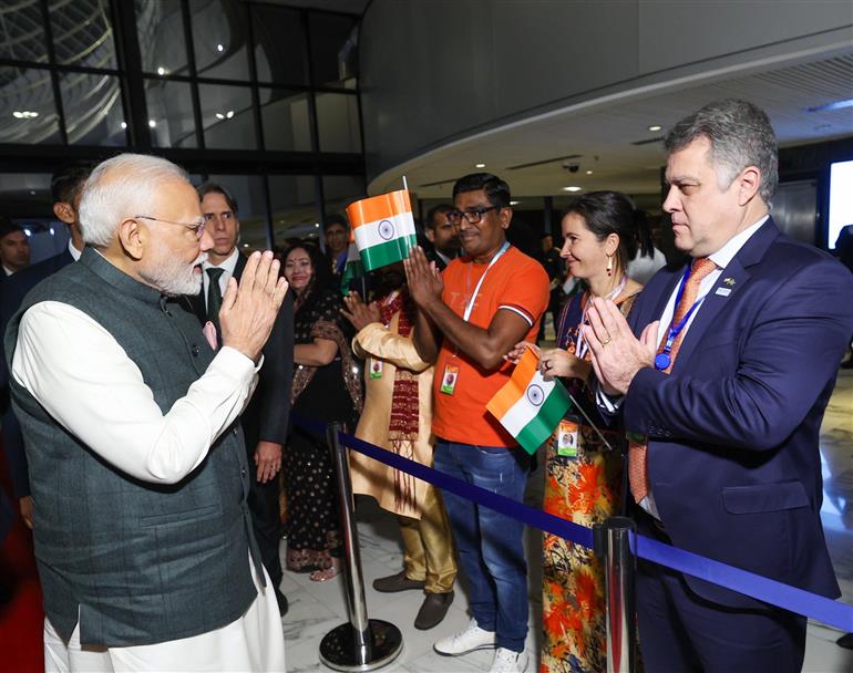PM receives a rousing welcome by Indian community on his arrival at  hotel, in Brasília, in Brazil on July 07, 2025.