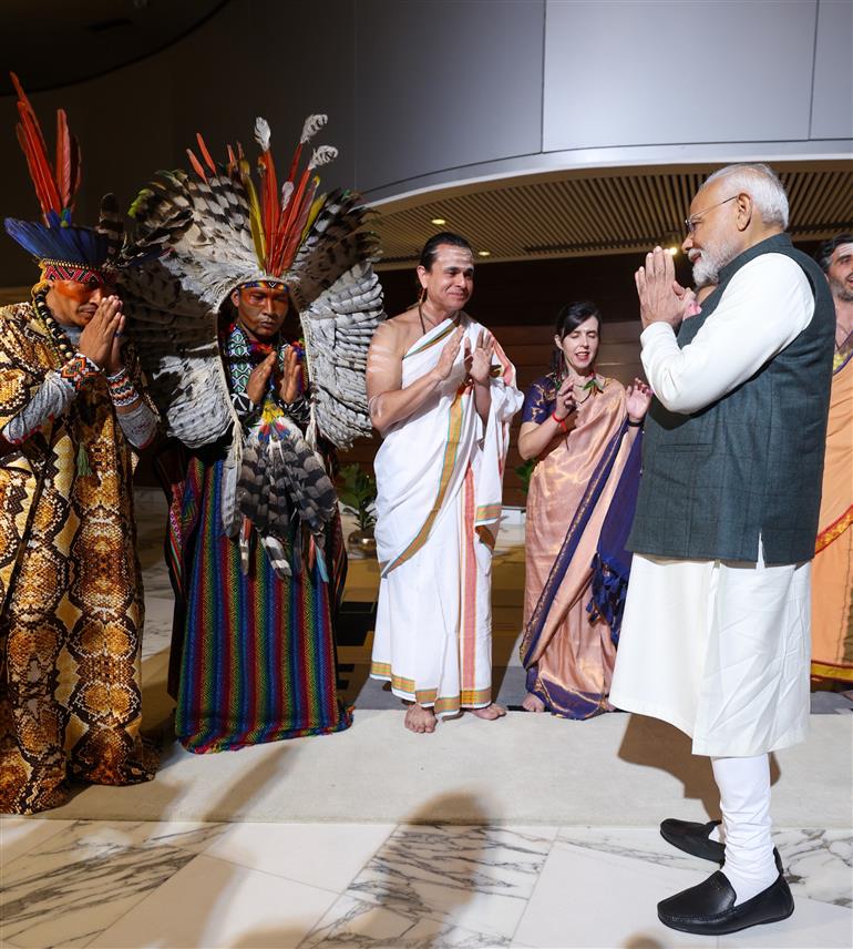 PM receives a cultural welcome by Acharya Jonas Masetti and group on his arrival at  hotel, in Brasília, in Brazil on July 07, 2025.