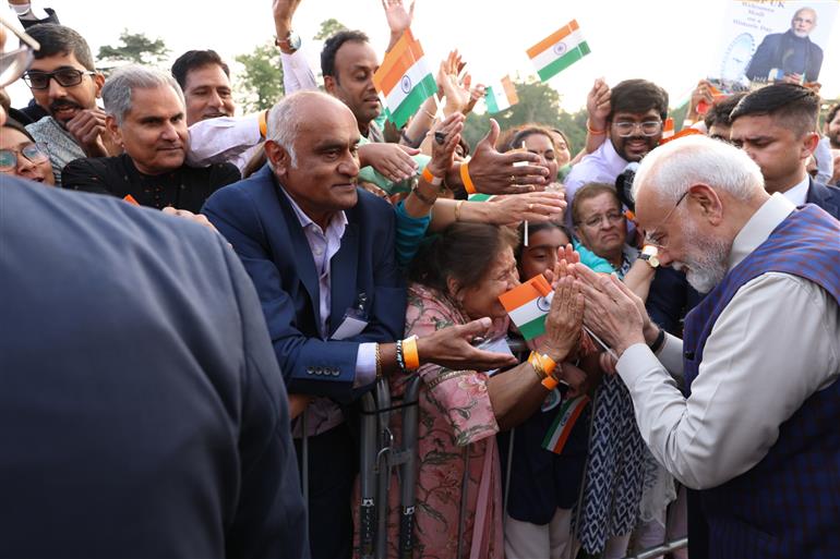 PM receives a rousing welcome by Indian community on his arrival at London, in United Kingdom on July 23, 2025.:Prime Minister's Office PM receives a rousing welcome by Indian community on his arrival at London, in United Kingdom on July 23, 2025.:Prime Minister