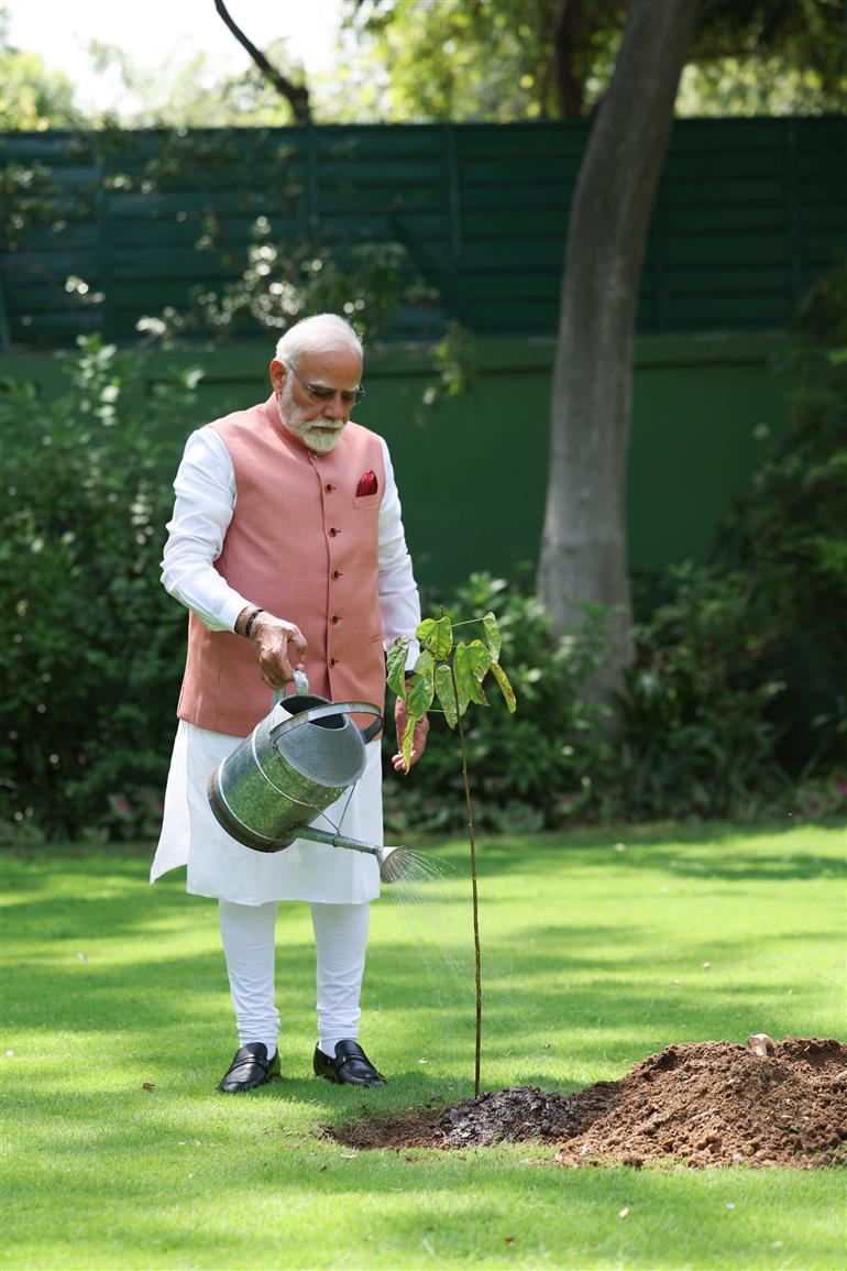 PM planting a sapling to mark the World Environment Day-2025 at his residence (7, Lok Kalyan Marg), in New Delhi on June 05, 2025.