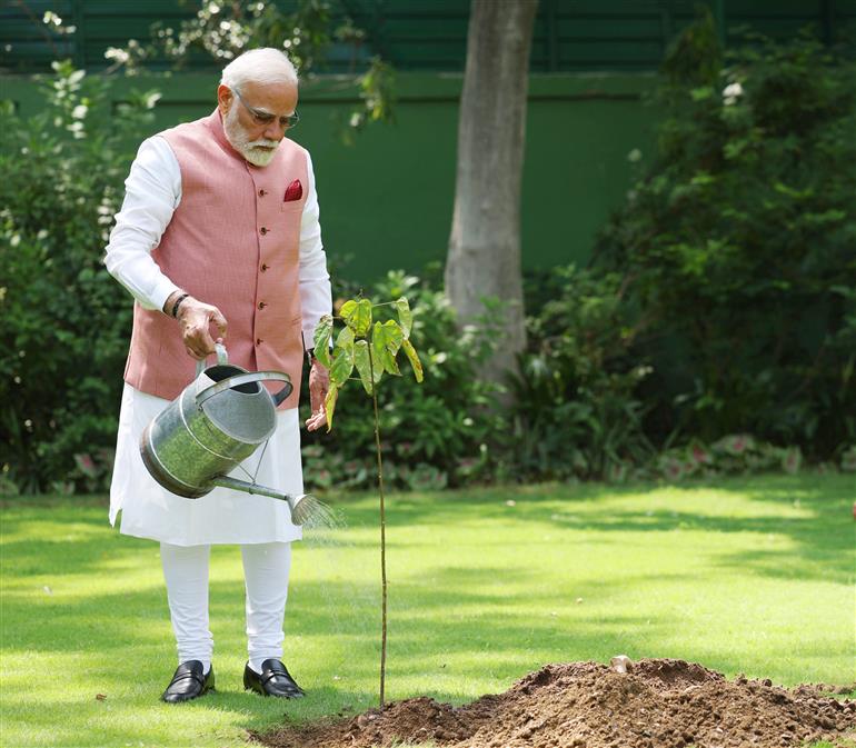 PM planting a sapling to mark the World Environment Day-2025 at his residence (7, Lok Kalyan Marg), in New Delhi on June 05, 2025.