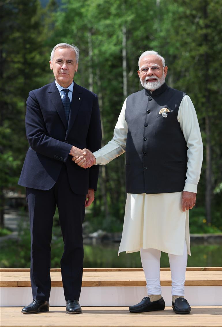 PM being welcomed by the Prime Minister of Canada, Mr. Mark Joseph Carney on the sidelines of the 51st G7 Summit at Kananaskis, in Canada on June 17, 2025.:Prime Minister's Office PM being welcomed by the Prime Minister of Canada, Mr. Mark Joseph Carney on the sidelines of the 51st G7 Summit at Kananaskis, in Canada on June 17, 2025.:Prime Minister
