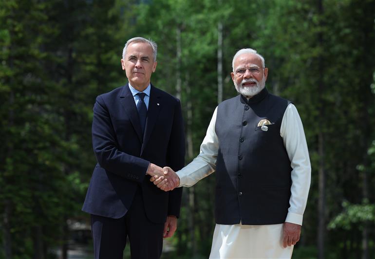 PM being welcomed by the Prime Minister of Canada, Mr. Mark Joseph Carney on the sidelines of the 51st G7 Summit at Kananaskis, in Canada on June 17, 2025.:Prime Minister's Office PM being welcomed by the Prime Minister of Canada, Mr. Mark Joseph Carney on the sidelines of the 51st G7 Summit at Kananaskis, in Canada on June 17, 2025.:Prime Minister
