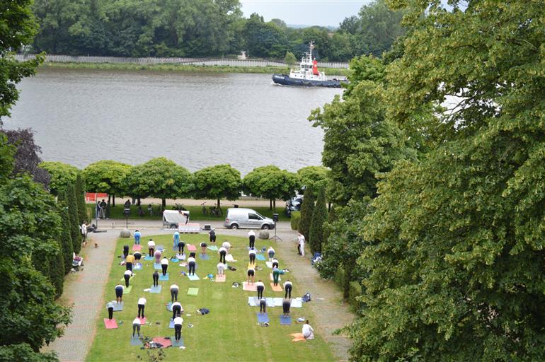 Celebrating the 11th International Day of Yoga with the 4th Open Air Sommer Yoga at the scenic Stadtgarten, Vegesack, Germany. Over 50 participants gathered in harmony with nature to honor this year’s theme: “Yoga for One Earth, One Health” on June 19, 2025.:AYUSH