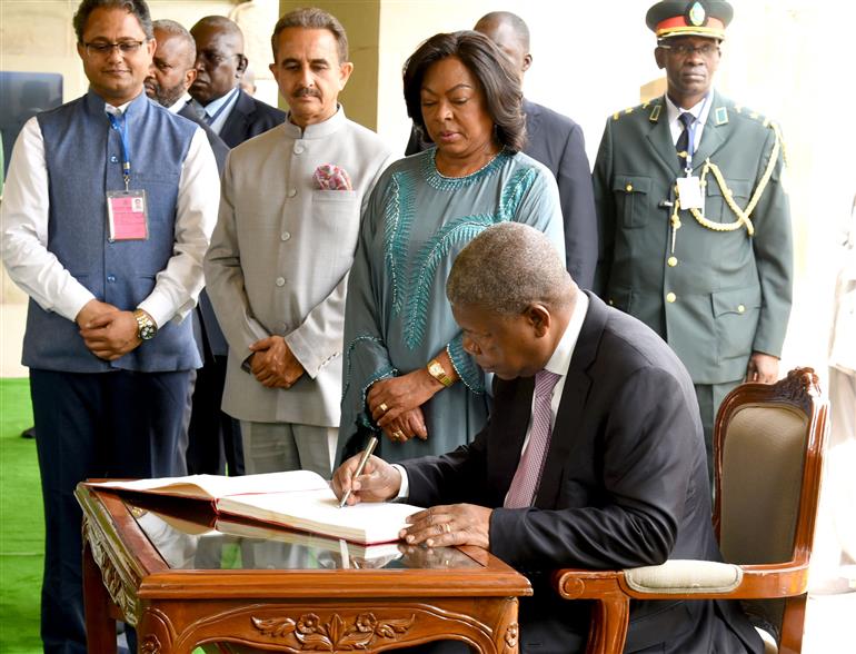 The President of the Republic of Angola, Mr. Joao Manuel Goncalves Lourenco writing his remarks in the visitor book at the Samadhi of Mahatma Gandhi at Rajghat, in Delhi on May 03, 2025.