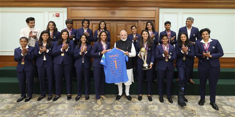 PM in a group photograph with Indian Women Cricket Team Players at 7, Lok Kalyan Marg , in New Delhi on November 05, 2025.