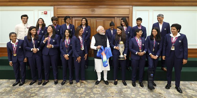 PM in a group photograph with Indian Women Cricket Team Players at 7, Lok Kalyan Marg, in New Delhi on November 05, 2025.