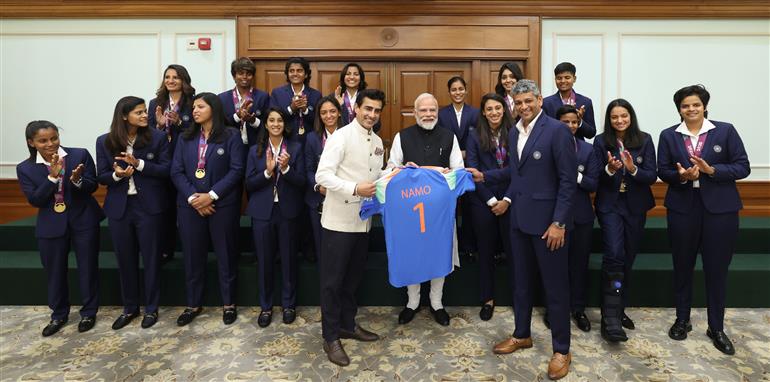 PM in a group photograph with Indian Women Cricket Team Players at 7, Lok Kalyan Marg, in New Delhi on November 05, 2025.