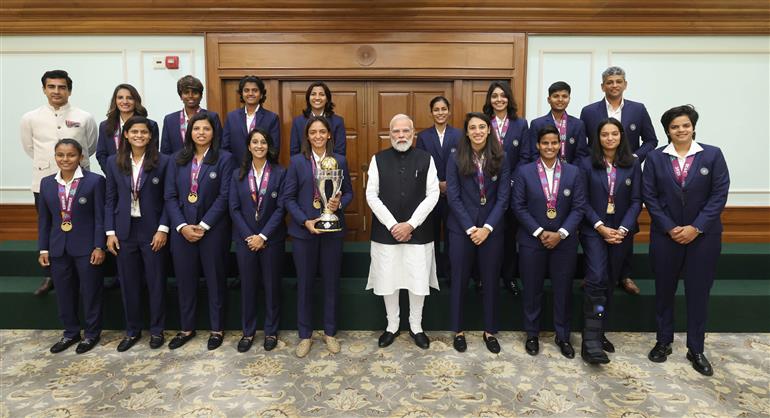 PM in a group photograph with Indian Women Cricket Team Players at 7, Lok Kalyan Marg, in New Delhi on November 05, 2025.