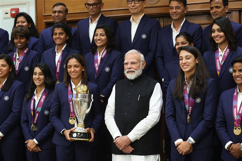 PM in a group photograph with Indian Women Cricket Team Players at 7, Lok Kalyan Marg, in New Delhi on November 05, 2025.