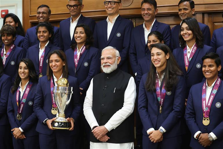 PM in a group photograph with Indian Women Cricket Team Players at 7, Lok Kalyan Marg, in New Delhi on November 05, 2025.