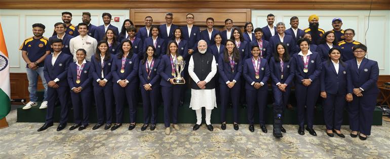 PM in a group photograph with Indian Women Cricket Team Players at 7, Lok Kalyan Marg, in New Delhi on November 05, 2025.