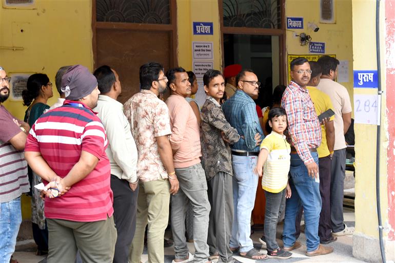 voters standing in queue to cast their votes at a polling booth during the 1st phase of the Bihar Assembly Election 2025 at Sri Guru Govind Singh Girl High School, Patna Sahib in Patna, Bihar on November 06, 2025.