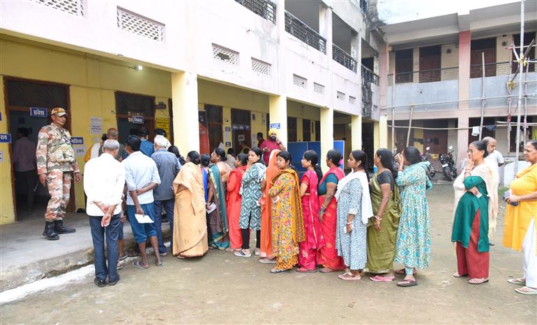 voters standing in queue to cast their votes at a polling booth during the 1st phase of the Bihar Assembly Election 2025 at Sri Guru Govind Singh Girl High School, Patna Sahib in Patna, Bihar on November 06, 2025.