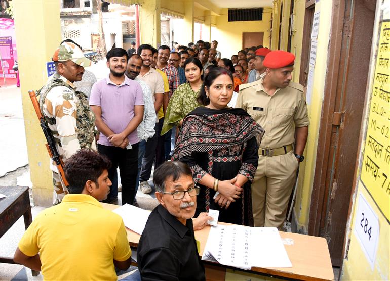 voters standing in queue to cast their votes at a polling booth during the 1st phase of the Bihar Assembly Election 2025 at Sri Guru Govind Singh Girl High School, Patna Sahib in Patna, Bihar on November 06, 2025.