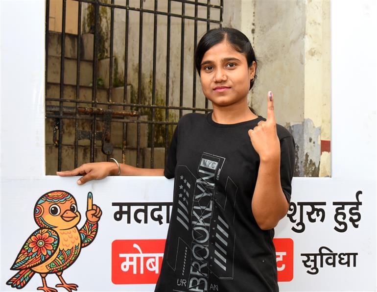 Voters showing mark of indelible ink after casting their votes at a polling booth during the 1st phase of the Bihar Assembly Election 2025 at Sri Guru Govind Singh Girl High School, Patna Sahib in Patna, Bihar on November 06, 2025.
