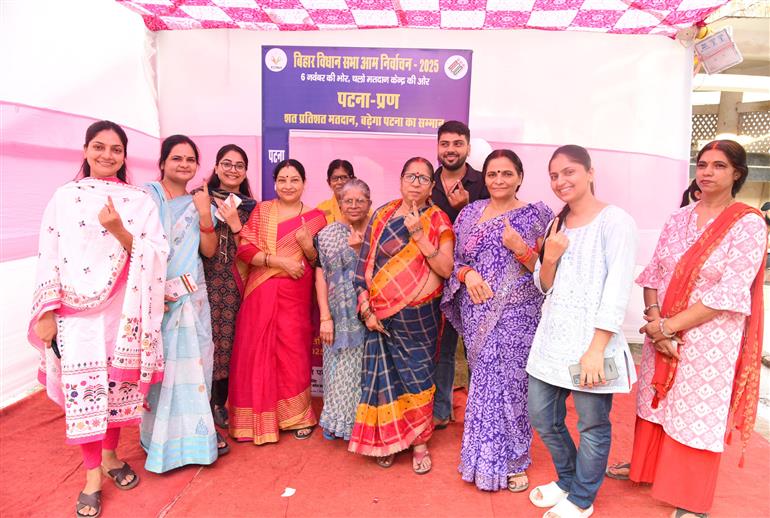 Voters showing mark of indelible ink after casting their votes at a polling booth during the 1st phase of the Bihar Assembly Election 2025 at Sri Guru Govind Singh Girl High School, Patna Sahib in Patna, Bihar on November 06, 2025.