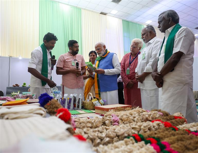 PM visits an exhibition and engages with farmers during the inauguration of the South India Natural Farming Summit 2025 at Coimbatore, in Tamil Nadu on November 19, 2025.