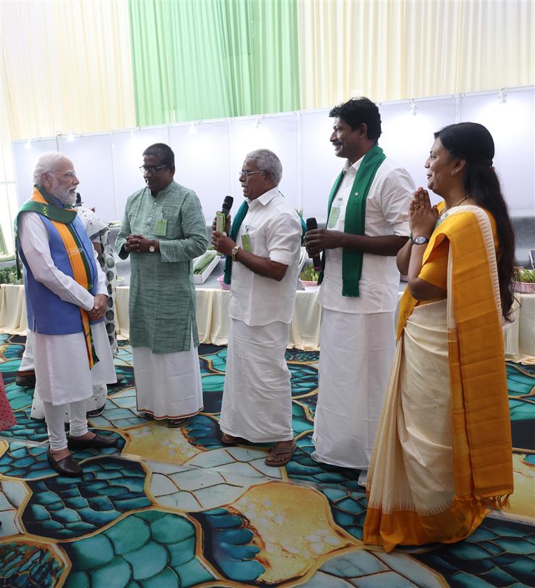 PM visits an exhibition and engages with farmers during the inauguration of the South India Natural Farming Summit 2025 at Coimbatore, in Tamil Nadu on November 19, 2025.