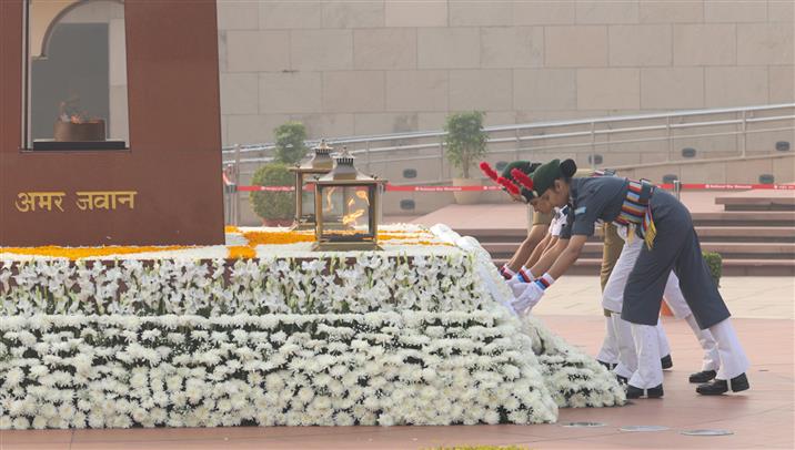 Three NCC girl cadets lays wreath and pays glowing tributes to the fallen heroes during the 78th Raising Day of the National Cadet Corps at the National War Memorial, in New Delhi, on November 22, 2025.