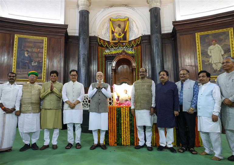 PM in a group photograph during the paid tributes to Mahatma Gandhi on the occasion of Gandhi Jayanti at Parliament House, in New Delhi on October 02, 2025.