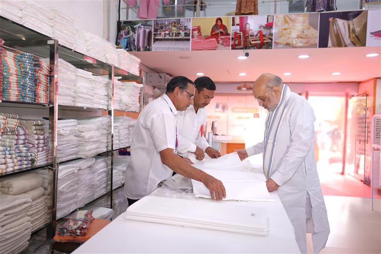 The Union Minister for Home Affairs and Cooperation, Shri Amit Shah visits Khadi India showroom on the occasion of Gandhi Jayanti at Connaught Place, in New Delhi on October 02, 2025.