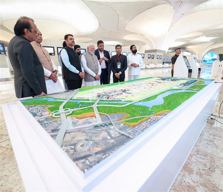 PM visits an exhibition during the inauguration of the Navi Mumbai International Airport at Mumbai, in Maharashtra on October 08, 2025.