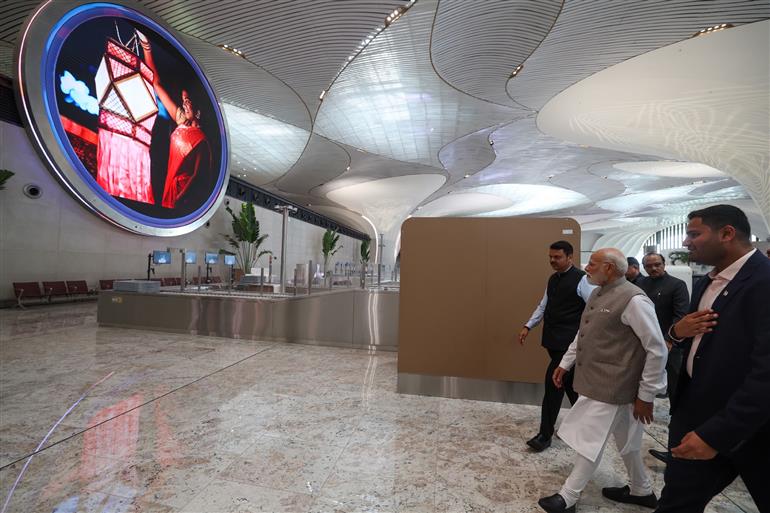 PM visits an exhibition during the inauguration of the Navi Mumbai International Airport at Mumbai, in Maharashtra on October 08, 2025. 