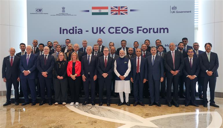 PM and UK PM Keir Starmer in a group photograph during attends the reconstituted India-UK CEOs Forum, in Mumbai on October 09, 2025.