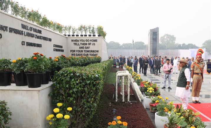 The Union Minister for Defence, Shri Rajnath Singh lays wreath and pays glowing tributes to police & paramilitary forces for their service to the nation on the occasion of Police Commemoration Day at National Police Memorial, in New Delhi on October 21, 2025.