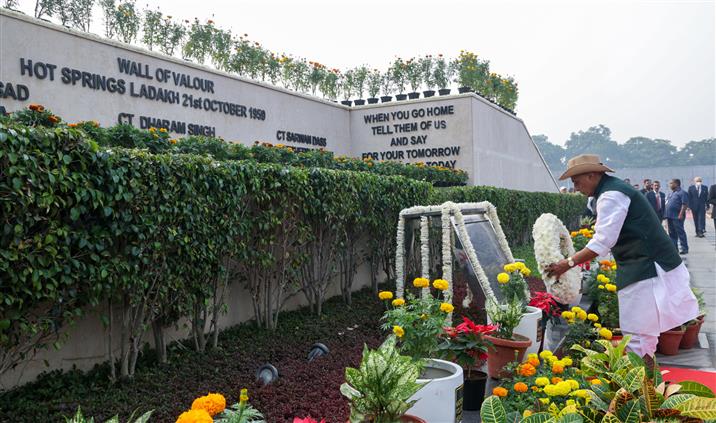 The Union Minister for Defence, Shri Rajnath Singh lays wreath and pays glowing tributes to police & paramilitary forces for their service to the nation on the occasion of Police Commemoration Day at National Police Memorial, in New Delhi on October 21, 2025.