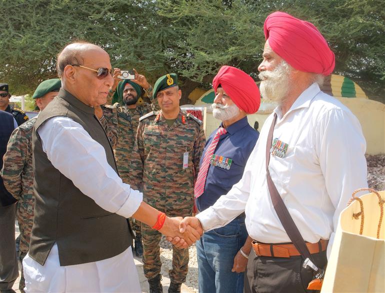 The Union Minister for Defence, Shri Rajnath Singh interacts with soldiers at Laungewala, in Rajasthan on October 24, 2025.
