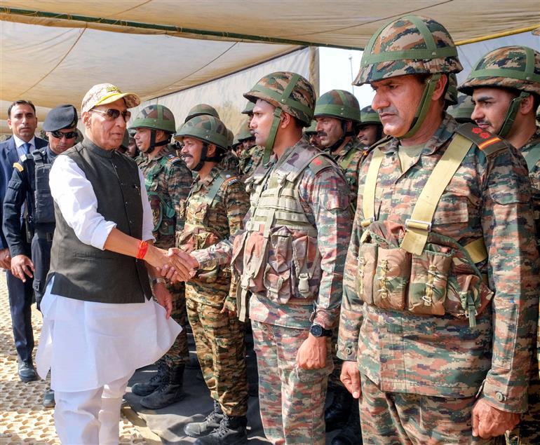 The Union Minister for Defence, Shri Rajnath Singh interacts with soldiers at Laungewala, in Rajasthan on October 24, 2025.
