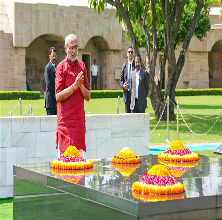 The Vice-President of India Shri C. P. Radhakrishnan pays floral tribute to Mahatma Gandhi at Rajghat, in Delhi on September 12, 2025.